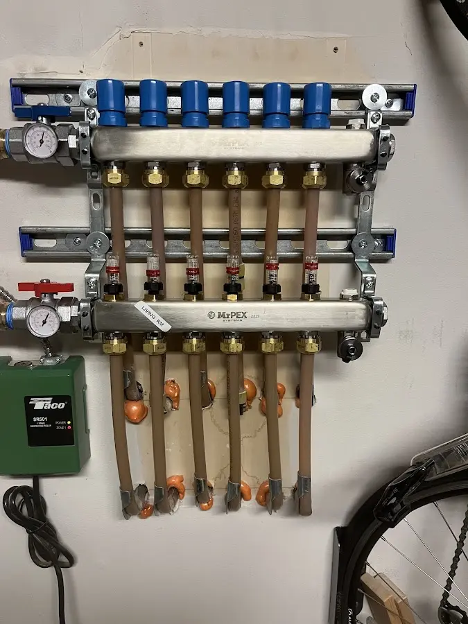 Plumber performing Water Heater Repair at a residential property in Goffstown